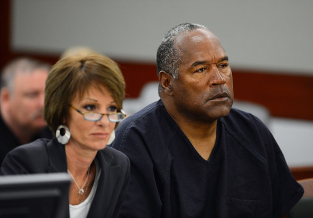 Defense attorney Patricia Palm, left, and O.J. Simpson appear at an evidentiary hearing in Clark County District Court on May 17, 2013 in Las Vegas. Simpson, who is currently serving a nine-to-33-year sentence in state prison as a result of his October 2008 conviction for armed robbery and kidnapping charges, is using a writ of habeas corpus to seek a new trial, claiming he had such bad representation that his conviction should be reversed. (AP Photo/Ethan Miller, Pool)