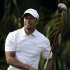 Tiger Woods follows his shot from the eighth tee during the third round of the Cadillac Championship golf tournament on Saturday, March 9, 2013, in Doral, Fla. (AP Photo/Wilfredo Lee)