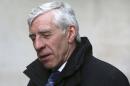 Former British foreign minister Jack Straw speaks to a television crew as he leaves a BBC building in London