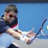 Janko Tipsarevic of Serbia hits a return to Julien Benneteau of France during their men's singles match at the Australian Open tennis tournament in Melbourne