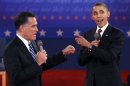 Republican presidential nominee Romney and U.S. President Obama answer a question at the same time during the second U.S. presidential campaign debate in Hempstead