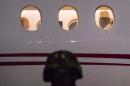 Former president Yaya Jammeh, who led Gambia for 22 years, looks through the plane window as he leaves the country on January 21, 2017 from Banjul airport