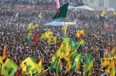 Some thousands of supporters demonstrate waving various PKK flags and images of jailed Kurdish rebel leader Abdullah Ocalan, in southeastern Turkish city of Diyarbakir, Turkey, Thursday, March 21, 2013, as Ocalan called Thursday for an immediate cease-fire and for thousands of his fighters to withdraw from Turkish territory, a major step toward ending the fighting for self-rule for Kurds in southeastern Turkey, one of the world's bloodiest insurgencies lasting nearly 30-years and costing tens of thousands of lives. (AP Photo)