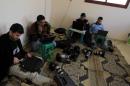 Palestinian journalists from different agencies work in a house in the southern Gaza Strip town of Rafah on November 19, 2012