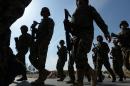 Afghanistan vowed action against Taliban-allied Uzbek insurgents after they posted a video purportedly showing the beheading of a former Afghan soldier