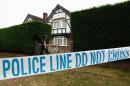 British police stand outside the home of Saad and Iqbal al-Hilli in Claygate, in Surrey, south-east England, on September 14, 2012