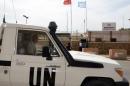 An UN vehicle drives past the headquarters of the United Nations Mission for the Referendum in Western Sahara (MINURSO) on May 13, 2013 in Laayoune
