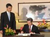 Hong Kong Chief Executive Leung Chun-Ying, left, watches as Mexican President Enrique Pena Nieto, right, signs the guest book before their official talks at Government House in Hong Kong on Friday April 5, 2013.  Enrique Pena Nieto arrived in Hong Kong on a trip aimed at deepening economic ties and widening relations with the Asia-Pacific region. (AP Photo / Dale de la Rey)