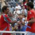 Ferrer of Spain is congratulated by Tipsarevic of Serbia after their men's singles quarterfinals match at the U.S. Open tennis tournament in New York