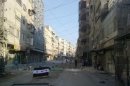 Syrian opposition militants blocking a road in the al-Tadamun neighbourhood of Damascus
