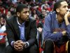 Cleveland Cavaliers' Kyrie Irving watches an NBA basketball game against the Chicago Bulls, Tuesday, Feb. 26, 2013, in Chicago. Irving sat the game out to rest his sore right knee. (AP Photo/Charles Cherney)
