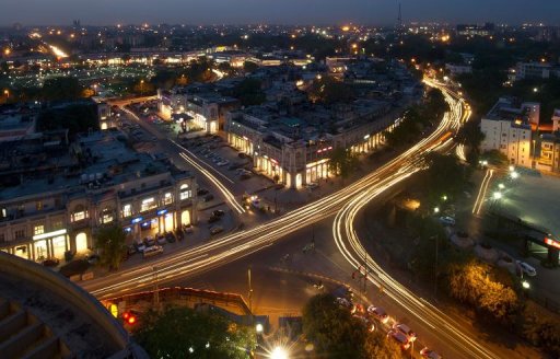 This photograph taken on April 18, 2013 shows the Indian capital's skyline as traffic drives around the outer circle of Connaught Place in the heart of New Delhi