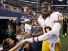 Redskins' Griffin III shakes hands with fans after the Redskins beat the Dallas Cowboy in Arlington