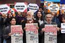 Protesters hold copies of Turkish daily newspaper "Cumhuriyet" during a demonstration outside the newspaper's headquarters in Ankara in November 2016, following the arrest of nine Cumhuriyet staff