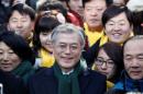 FILE PHOTO: Moon Jae-in, former human rights lawyer and presidential candidate of the main opposition Democratic United Party, attends a campaign encouraging people to vote, in Seoul