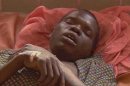 A victim of the Ebola virus outbreak lies in a hospital bed in the Gulu region of northern Uganda, O..