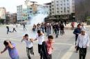 Riot police use tear gas to disperse demonstrators, during a protest against Saturday's bomb blasts in Ankara, in the Kurdish dominated southeastern city of Diyarbakir