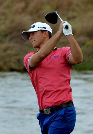 Tournament leader Luke Guthrie of the US tees off at …