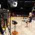 YES Network sports reporter Kustok talks on the court before the Los Angeles Lakers play against the Brooklyn Nets in a NBA basketball game in Los Angeles