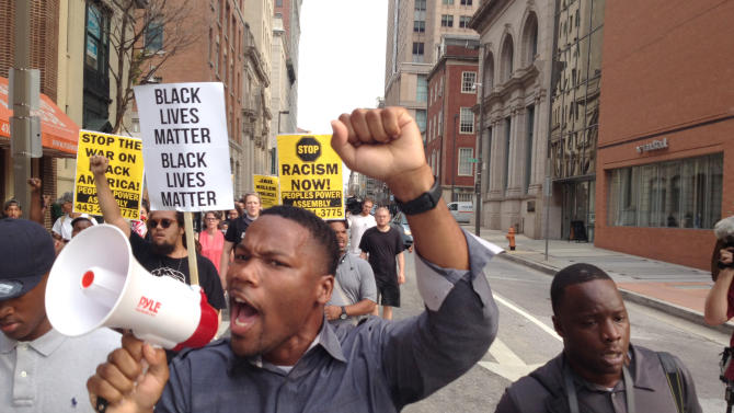 FILE - In a Wednesday, Sept. 2, 2015 file photo, Pastor Westley West, from Faith Empowered Ministries, leads protesters as they march towards Pratt Street and the Inner Harbor, in Baltimore, as the first court hearing was set to begin for six police officers criminally charged in the death of Freddie Gray. West was arrested Wednesday, Sept. 9, a week after police say he blocked traffic while protesting during pre-trial hearings in the Freddie Gray case. He is charged with attempting to incite a riot, malicious destruction of property, disorderly conduct, disturbance of the peace, false imprisonment and failure to obey.  (Lloyd Fox/The Baltimore Sun via AP, File)  WASHINGTON EXAMINER OUT; MANDATORY CREDIT