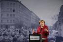 German Chancellor Merkel speaks at the exhibition opening during a ceremony marking the 25th anniversary of the fall of the Berlin Wall at a memorial in Bernauer Strasse in Berlin