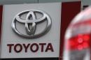A sign with a logo is on display at a Toyota car sales and sho room in St. Petersburg