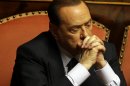 In this photo taken on Friday, July 19, 2013 Silvio Berlusconi attends a voting session at the Senate in Rome. Silvio Berlusconi, the billionaire media baron and former premier, sometimes quipped that he was running out of money after two decade of steadily paying millions of euros (dollars) to a stable of Italy's leading lawyers to defend him in a raft of criminal cases. The legal team earned its keep, either eventually scoring acquittals or devising strategies that helped stretch out the court calendar for so long the cases died when statutes of limitations ran out. But this time, they failed to deliver him from final judgment day for a guilty verdict that arrives Tuesday at Italy's highest court, and Berlusconi's no longer joking. (AP Photo/Gregorio Borgia)