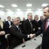 Greece's PM Samaras shakes hands with his lawmakers at the headquarters of conservative New Democracy party in Athens