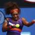 Serena Williams of the U.S. hits a return to Garbine Muguruza of Spain during their women's singles match at the Australian Open tennis tournament in Melbourne