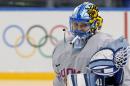 Goalkeeper of Finland's women's ice hockey team Noora Raty catches a puck during a practice session ahead of the 2014 Winter Olympics, Thursday, Feb. 6, 2014, in Sochi, Russia. (AP Photo/Petr David Josek)