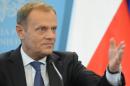 Polish Prime Minister Donald Tusk speaks during a press conference in Warsaw, Poland, Thursday, June 19, 2014. Tusk said early elections within weeks may be necessary if an expanding political crisis sparked by eavesdropping on political leaders is not contained. (AP Photo/Alik Keplicz)