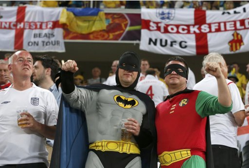 England soccer fans dressed as Batman and Robin cheer before their Group D Euro 2012 soccer match against Ukraine at the Donbass Arena in Donetsk