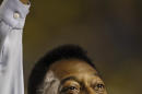 FILE - In this Nov. 19, 2008 file photo, Brazil's soccer great Pele greets supporters prior to a friendly soccer match, in Brasilia, Brazil. A Brazilian hospital says Pele has been transferred to a "special care" unit to be monitored while being treated for a urinary infection. The Albert Einstein hospital in Sao Paulo, said in a statement Thursday. Nov. 27, 2014, that the 74-year-old Pele was transferred to a quieter wing. (AP Photo/Silvia Izquierdo, File)