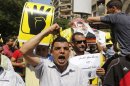 A supporter of Mursi shouts slogans against the military and the interior ministry during a protest in Cairo