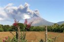 The San Cristobal volcano spews up large clouds of gas and ash near Chinandegga City