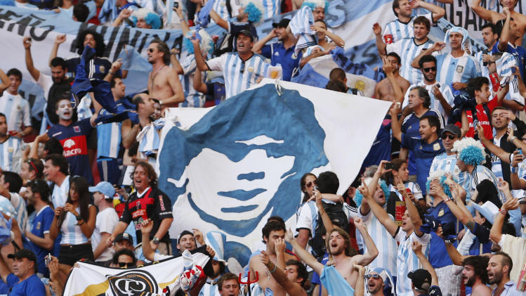 Argentina&#39;s fans celebrate at the end of the World Cup quarterfinal soccer match between Argentina and Belgium at the Estadio Nacional in Brasilia, Brazil, Saturday, July 5, 2014. Argentina won 1-0