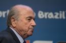 FIFA President Sepp Blatter arrives for a press conference where he talked about the organization and infrastructure of the upcoming World Cup, in Sao Paulo, Brazil, Thursday, June 5, 2014. The World Cup soccer tournament starts on 12 June. (AP Photo/Andre Penner)