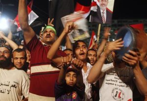 Supporters of deposed president Mursi chant slogans …