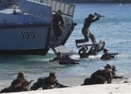 Philippine Military Academy (PMA) cadets move ashore from a navy ship during a joint field training exercise at the Marines' training centre in Ternate, Cavite city, south of Manila May 29, 2013. REUTERS/Romeo Ranoco