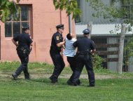Police remove a man from the site of a campaign event by US President Barack Obama, September 1, in Urbandale, Iowa. Obama and his Republican challenger Mitt Romney derided each other's record on job creation as they made a fresh push through key battleground states