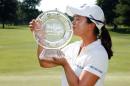 Kim Sei-Young of South Korea kisses the championship trophy after winning the Meijer LPGA Classic on the first playoff hole, at Blythefield Country Club in Belmont, Michigan, on June 19, 2016