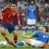 Spain's Xavi Hernandez evades a tackle from Italy's Riccardo Montolivo in Sunday's final