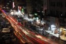 A view is seen of a busy street in Karachi