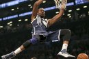 Oklahoma City Thunder Kevin Durant stuffs ball against Brooklyn Nets in NBA game in New York