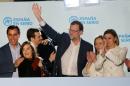 Spanish Prime Minister and Popular Party (PP) leader Mariano Rajoy (C) said in Madrid he would strive to form a government