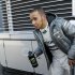 Mercedes Formula One driver Hamilton of Britain walks by the paddock during a training session at Circuit de Catalunya racetrack in Montmelo