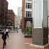 A pedestrian walks past the headquarters of State Street Bank in Boston
