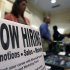 In this Thursday, Oct. 25, 2012, photo, a sign attracts job-seekers during a job fair at the Marriott Hotel in Colonie, N.Y. According to government reports released Friday, Nov. 2, 2012, the U.S. economy added 171,000 jobs in October, and the unemployment rate ticked up to 7.9 percent. (AP Photo/Mike Groll)