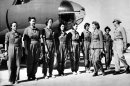 FILE - This Sept. 22, 1942 black-and-white file photo shows Aviatrix Nancy Harkness Love, director of the Women's Auxiliary Ferry Squadron (WAFS), and Col. Robert H. Baker, commanding officer, inspect the first contingent of women pilots in the WAFS at the New Castle Army Air Base, Del. Women served and died on the nation's battlefields from the first. They were nurses and cooks, spies and couriers in the Revolutionary War. Some disguised themselves as men to fight for the Union or the Confederacy. Yet the U.S. military's official acceptance of women in combat took more than two centuries. New roles for females were doled out fitfully _ whenever commanders got in a bind and realized they needed women's help. A look at milestones on the way to lifting the ban on women in ground combat. (AP Photo, File)