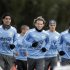 Uruguay's national soccer team players jog during a team practice in Montevideo